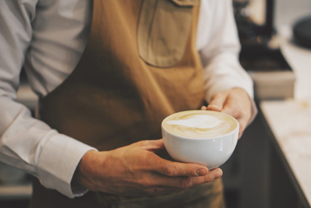 Team member serving coffee at Rheged